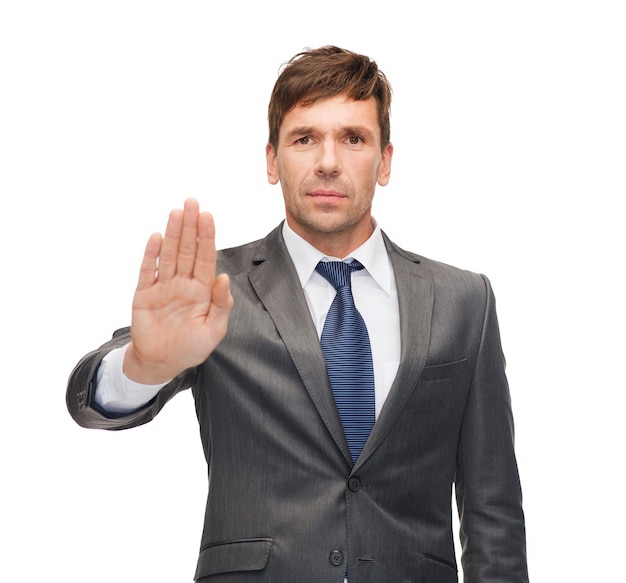 negócios e escritório, proibição, veto, conceito de aviso - empresário atraente fazendo gesto de parada