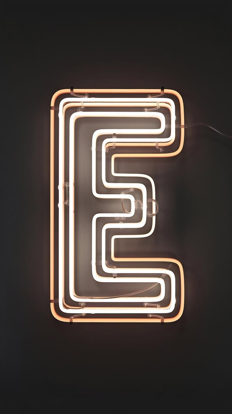 Foto neon luz retro letra del alfabeto e aislada en un fondo negro con camino de recorte