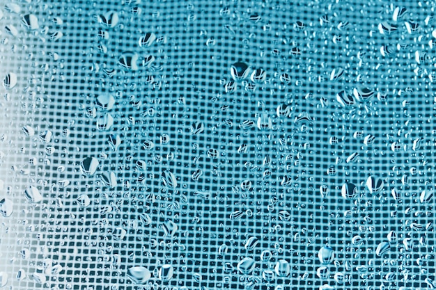 Netz abstrakter Hintergrund in Blau mit Wassertropfen