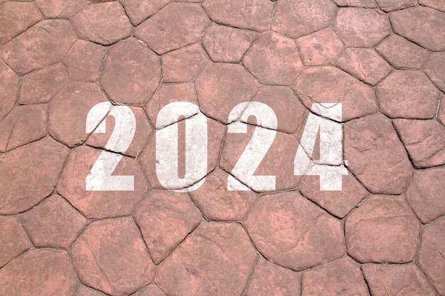 Foto neues jahr 2024 der text von 2024 ist auf dem boden geschrieben