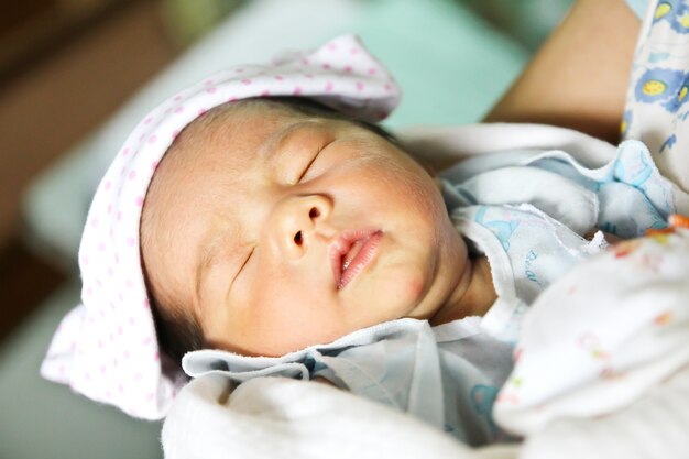 Newborn Asian baby girl sleeping