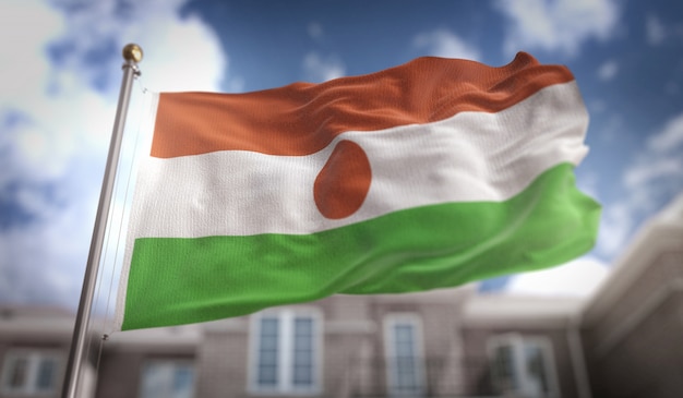 Niger-Flagge 3D-Rendering auf blauem Himmel Gebäude Hintergrund