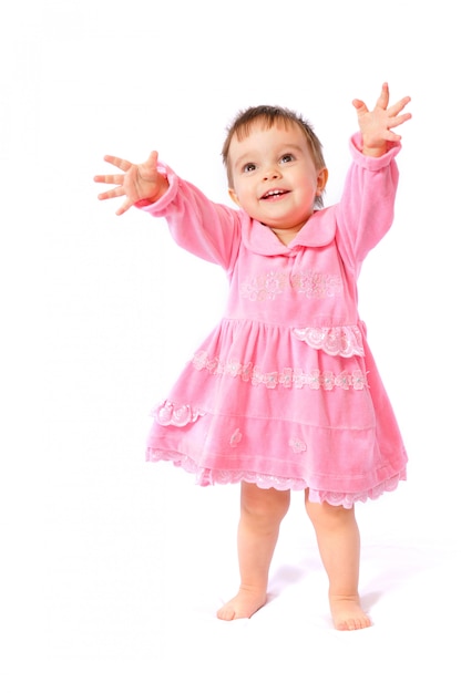 Foto niña de un año con un vestido rosa