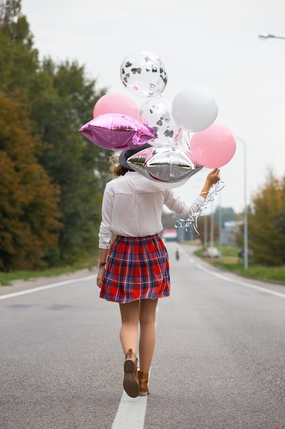 Niña con globo