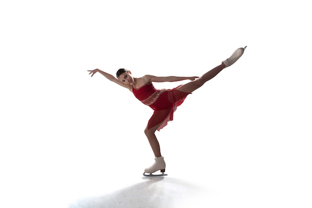 Niña de patinaje artístico aislada en blanco