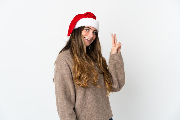 niña con sombrero de navidad aislado sobre fondo blanco