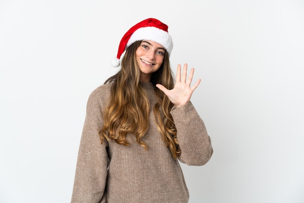 niña con sombrero de navidad aislado sobre fondo blanco