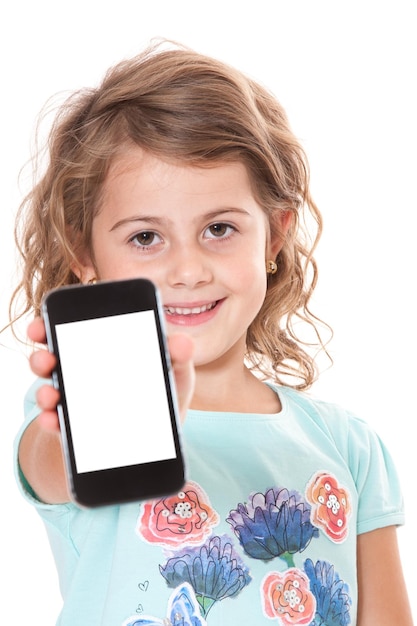 Foto niña con un teléfono móvil