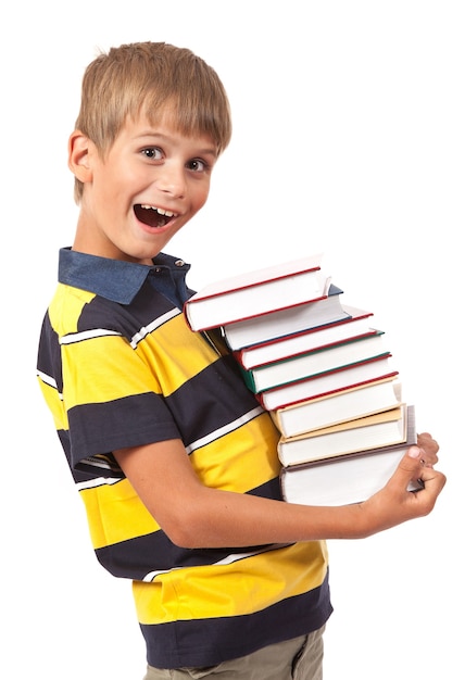 Foto niño de la escuela está sosteniendo libros