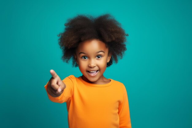 niño feliz mostrando el dedo índice sobre fondo azul ai generativo