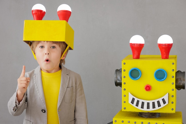 Foto niño feliz con robot. niño divertido jugando en casa. concepto de tecnología de éxito, creatividad e innovación.