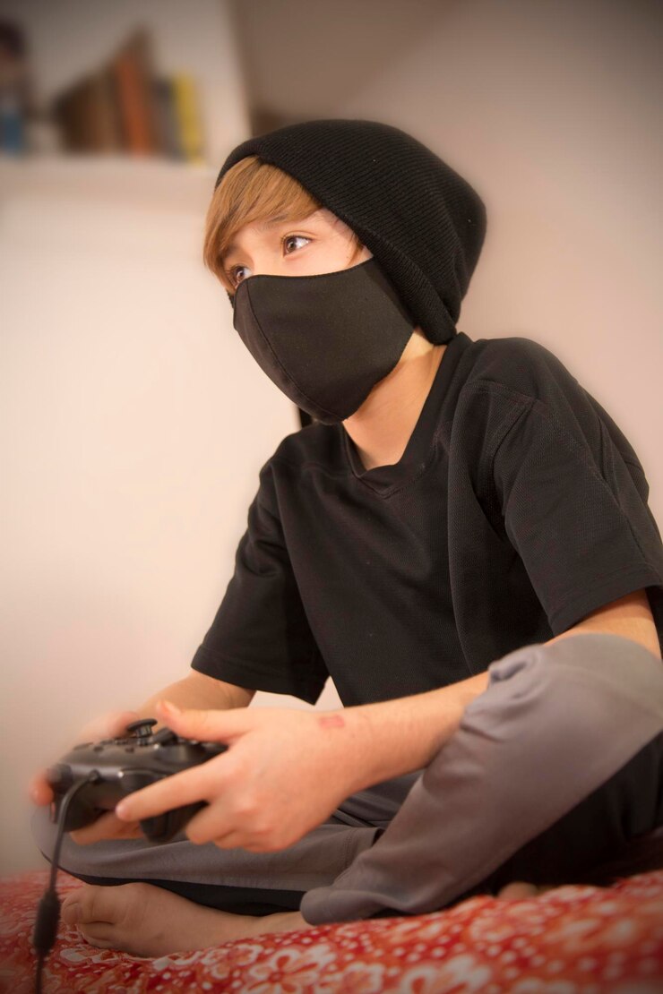 Foto niño con juego de control