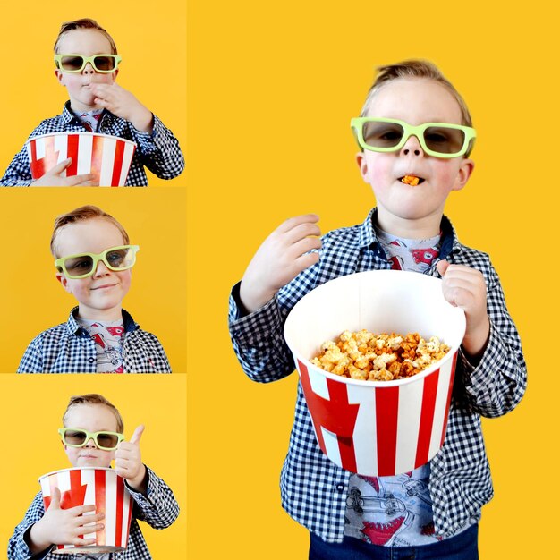 Un niño lindo y divertido, un niño de un año de edad, con una camiseta roja, sosteniendo un cubo para palomitas de maíz.