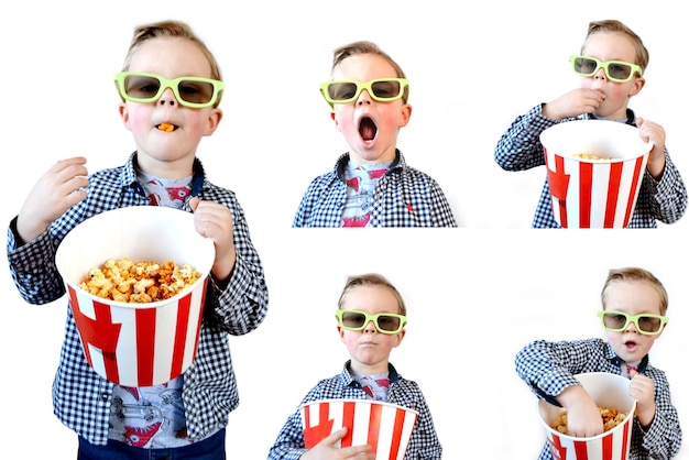 Un niño lindo y divertido, un niño de un año de edad, con una camiseta roja, sosteniendo un cubo para palomitas de maíz.