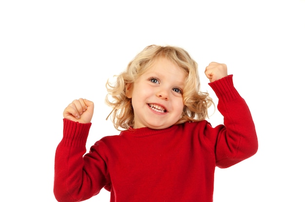 Niño pequeño feliz alzando sus brazos