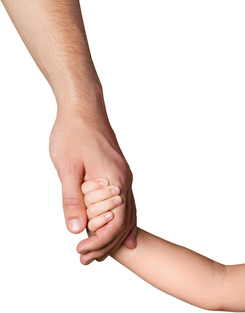 Niño sosteniendo la mano del padre