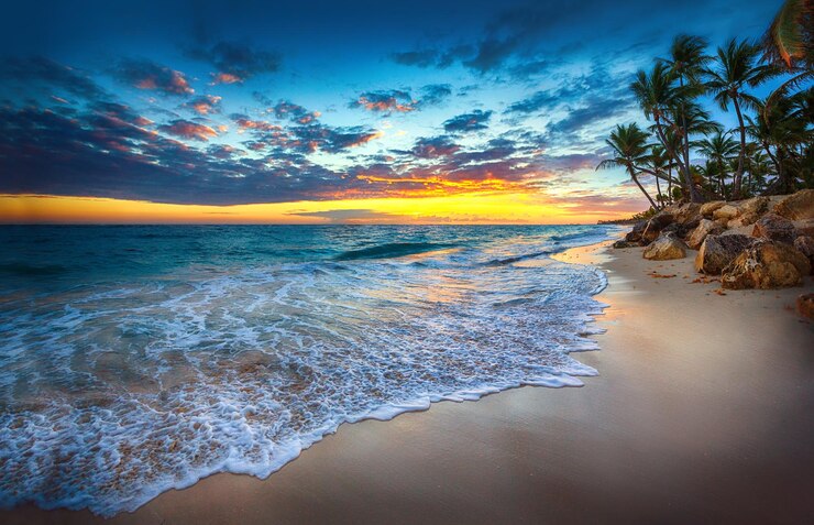 Foto no hay humanos playa al aire libre paisaje de árboles nubes cielo océano arena palmera puesta de sol horizonte rocoso orilla del agua