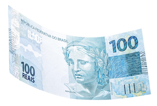 Nota de cem reais do brasil caindo sobre fundo branco isolado