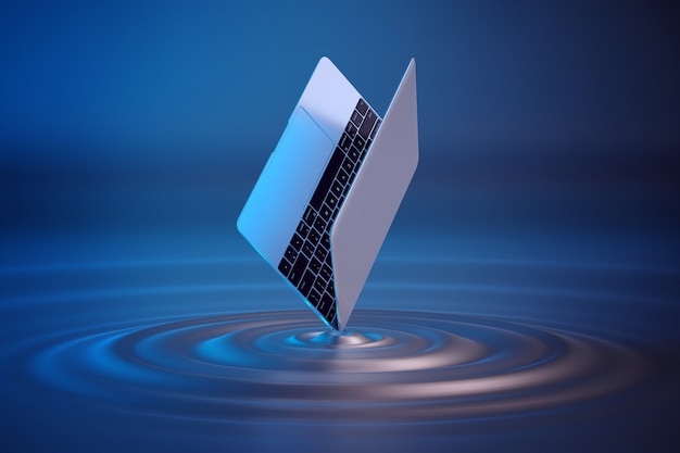 Nueva laptop balanceándose con agua