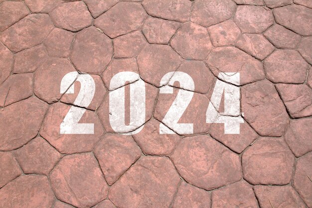 Foto nuevo año 2024 el texto de 2024 ha escrito en el suelo