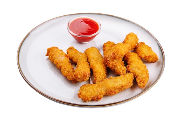 Nuggets de pollo con salsa en plato