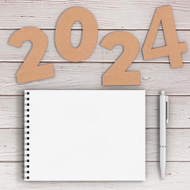 Foto números de cartulina 2024 signo de feliz año nuevo cerca de cuaderno de cubierta de papel espiral blanco con bolígrafo sobre fondo de mesa de madera representación 3d