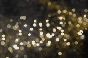 O brilho do ouro de natal brilha no fundo preto padrão abstrato festivo de natal