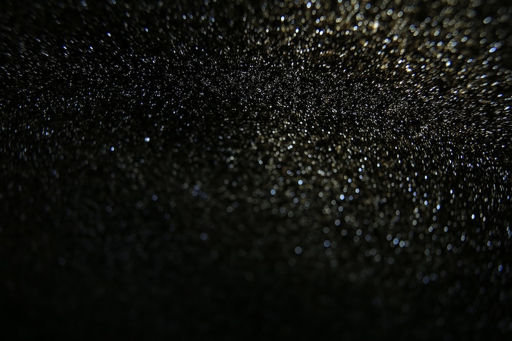 Foto o brilho do vintage ilumina o quadro. fundo escuro abstrato das luzes de dark.glitter.