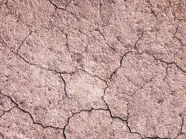 O chão tem rachaduras na vista superior para o plano de fundo