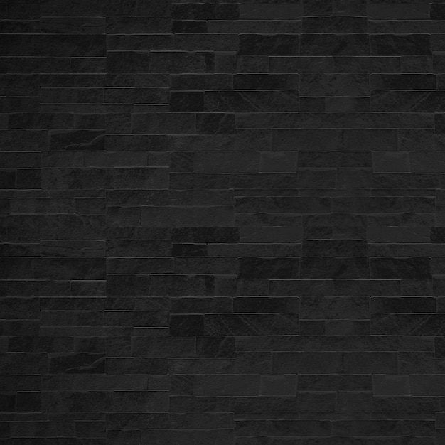 O fundo de textura de padrão de parede de pedra preta