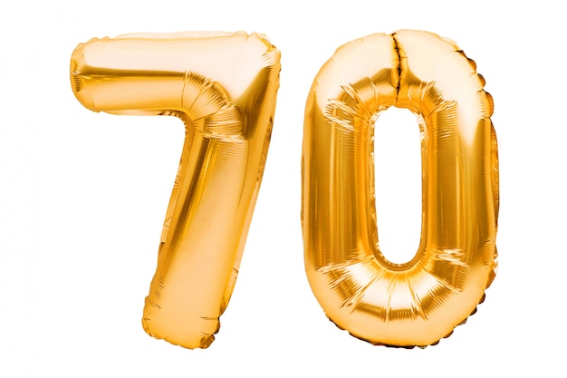O número 70 setenta feito dos balões infláveis dourados isolados no branco. Balões de hélio, números de folha de ouro.