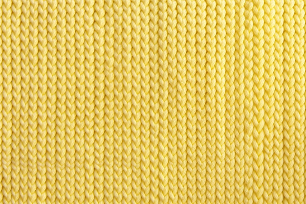 O padrão amarelo pastel tricotado irradia calor