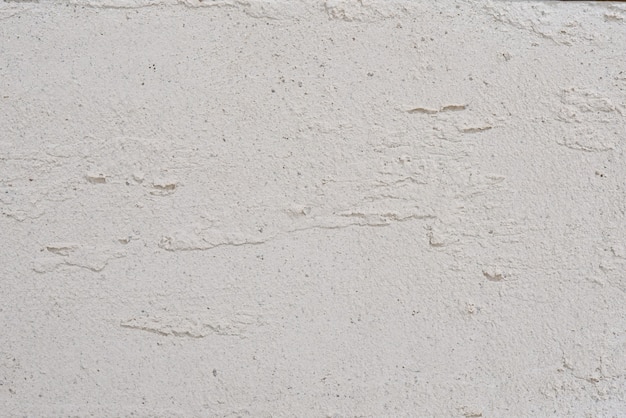 O padrão de fundo e textura de gesso branco. Cenário natural de cimento branco.