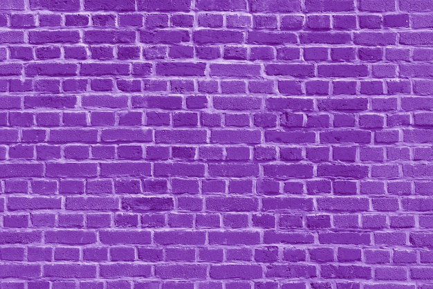 O plano de fundo do antigo papel de parede de tijolo violeta