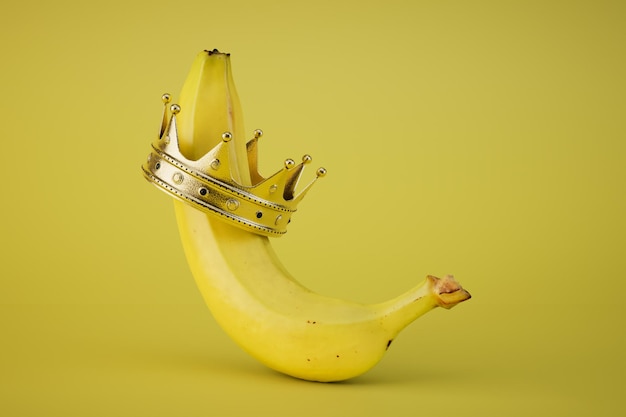 O rei das bananas uma banana em uma coroa em uma renderização 3D de fundo amarelo