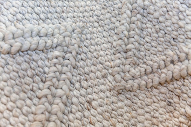 Oberfläche des gewebten Teppichs in Naturfarbe Hobby und Handarbeit Nahaufnahme Platz für Text