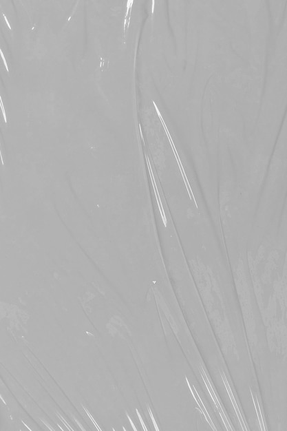 Foto obturación de plástico arrugado envoltura de plástico grunge sobre fondo blanco textura de película estirada transparente de polietileno