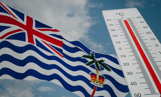 Foto ola de calor en el territorio británico del océano índico termómetro frente a la bandera biot y el cielo