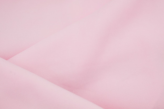 Foto ola sobre fondo abstracto de textura de tela de tela rosa