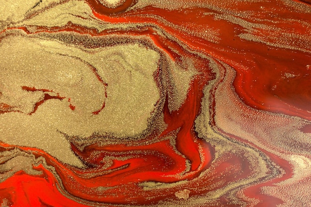 Ondas de ouro em fundo vermelho escuro