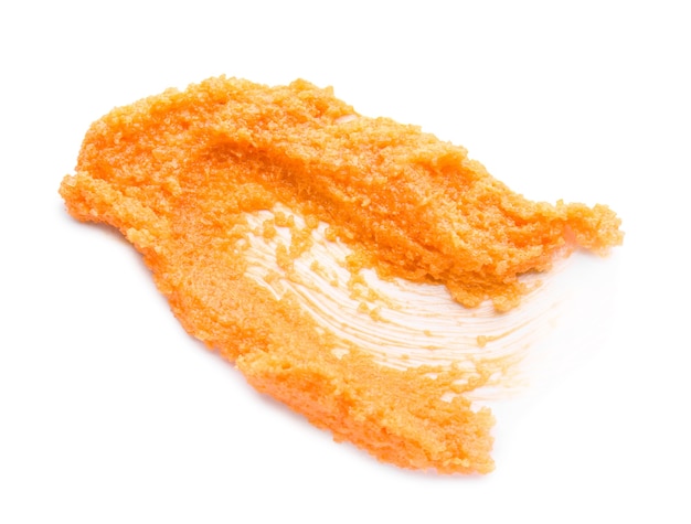 Orange Körperpeeling auf Weiß
