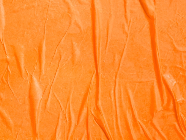 Orange Papierhintergrund der Nahaufnahme