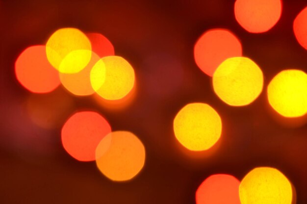 Orange und rotes bokeh Der Hintergrund mit boke Abstrakte Beschaffenheit