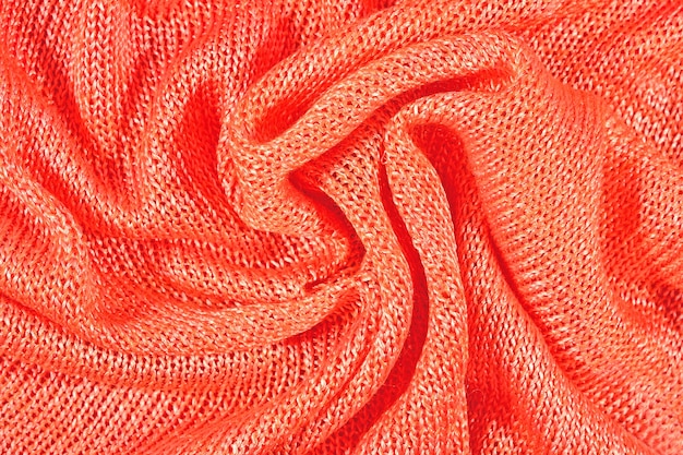 Orange zerknittertes Stockinet als Hintergrund