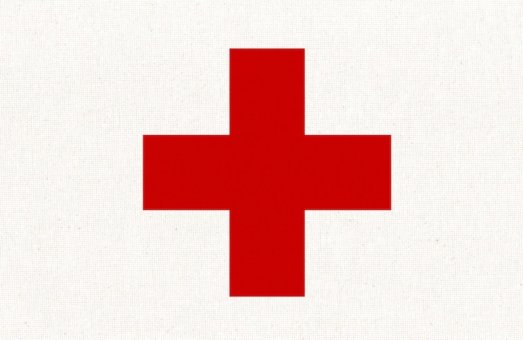 Foto organização humanitária internacional do cicv bandeira da cruz vermelha na superfície do tecido