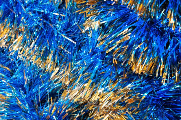 Oropel azul brillante, fondo de Navidad, textura