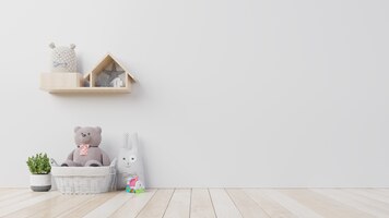 Foto oso de peluche y muñeca de conejo en la habitación de los niños en la pared.