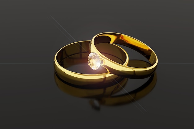 Paar Eheringe aus Gold und Diamant lokalisiert auf dunklem Hintergrund.