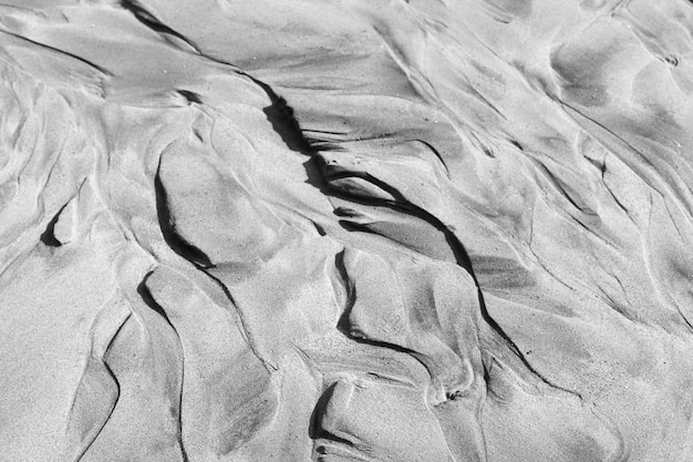 Padrão abstrato perfeito de areia do mar formado após a maré