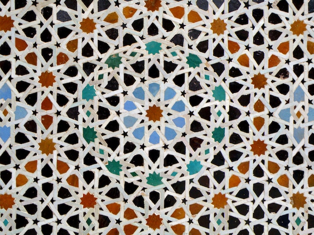 Padrão de estrelas de estilo marroquino azul laranja preto cor azulejos de parede em Fez, Marrocos, fundo, padrão